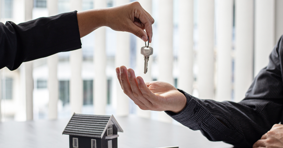 Highest Rental Yield Sydney - Person Giving A Key Of A House To Another Person