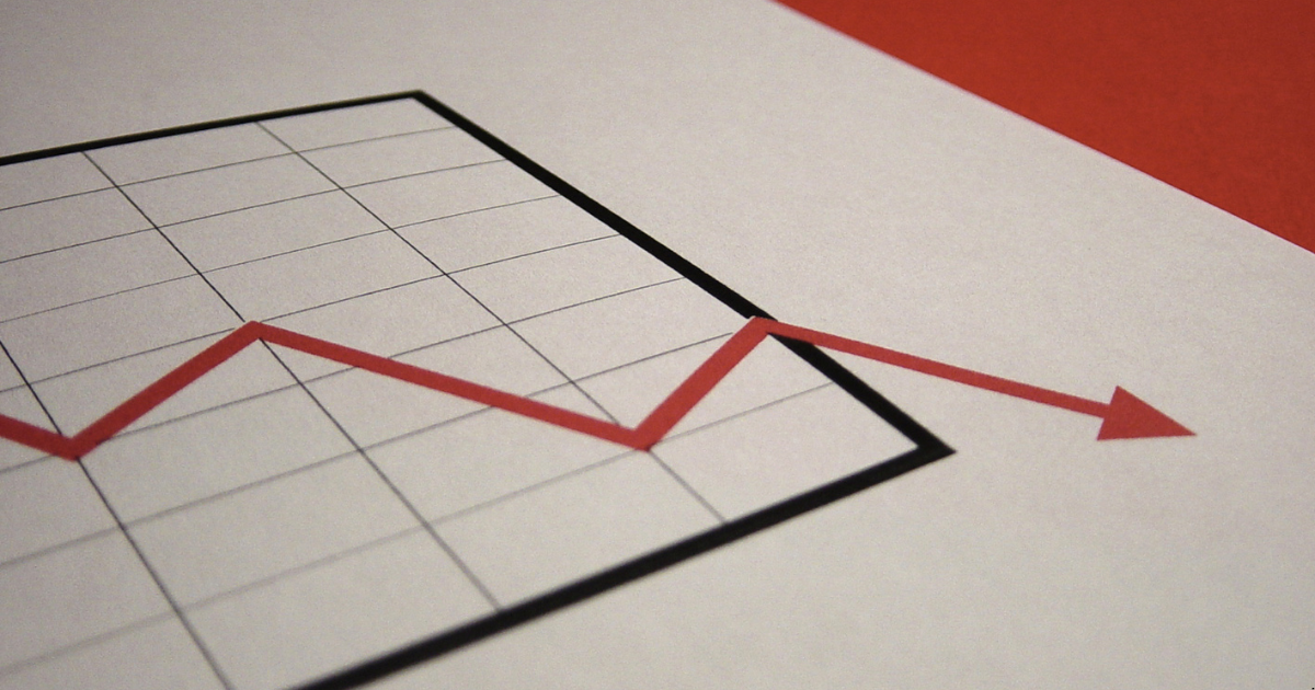 An downward arrow showing decline in income in negative gearing property